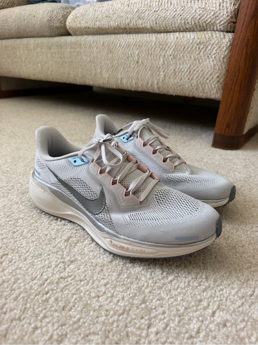 Nike Women’s Light Gray Running Shoes with Pink and Blue Accents
